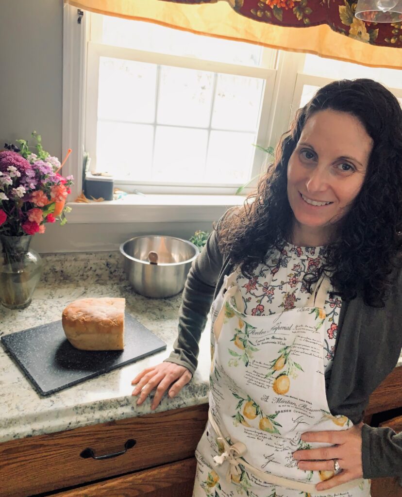 Holly in kitchen with home made oatmeal bread.